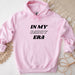 a pink hoodie that says in my daddy era