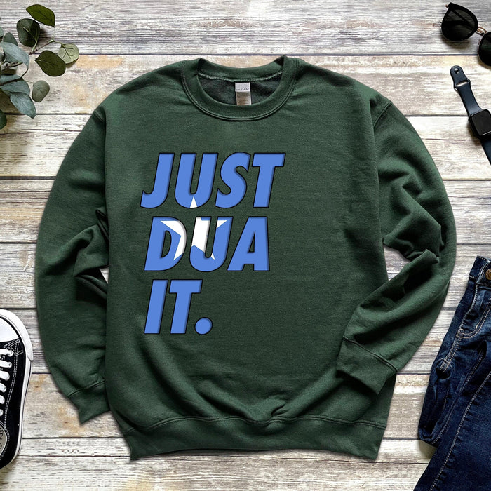 a green sweatshirt that says just dua it