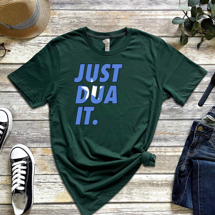 a t - shirt that says just dua it next to a pair of jeans