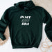 a green hoodie with the words in my arup bra printed on it