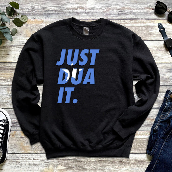 a sweatshirt that says just dua it next to a pair of jeans