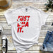 a white t - shirt with the words just do it printed on it