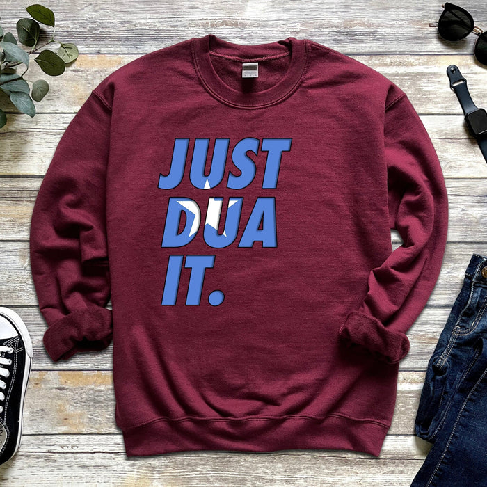 a red sweatshirt that says just dua it